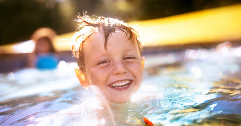 Child swimming in pool
