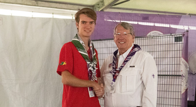 Jean Perea shaked hands with Scott Sorrels after Sorrels presented Jean with the National Medal of Merit.