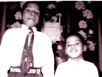 Elijah Cummings and his brother smile at the camera.