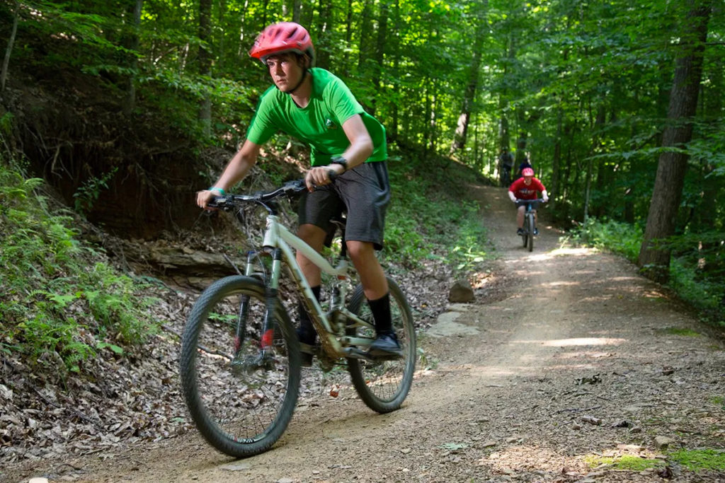 Venturer going down a hill on mountain bike.
