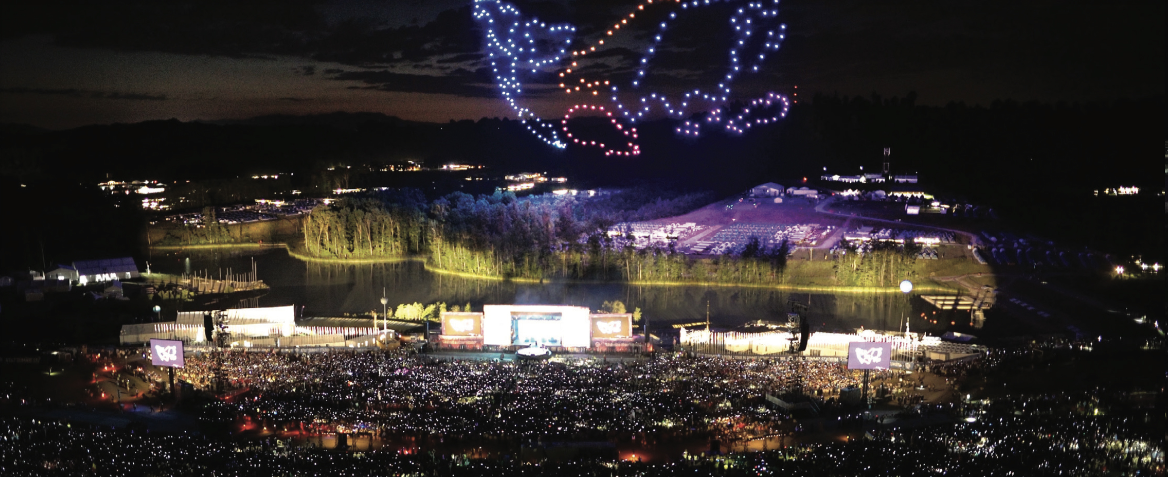 A swarm of 250 drones lights up the night sky.