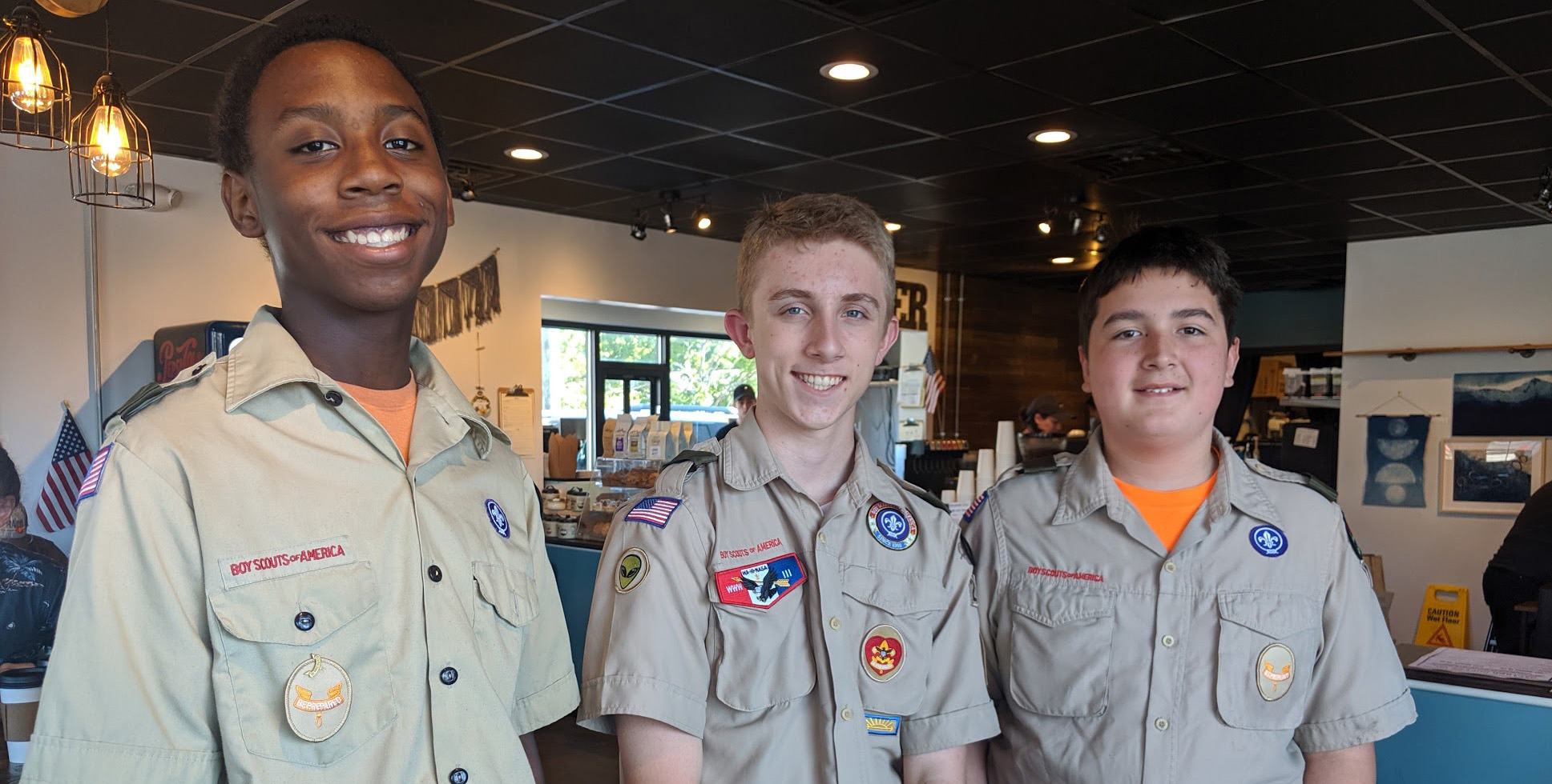 Austin (middle) and two of his helpers during the collection day at Caliber Coffee in September 2019.