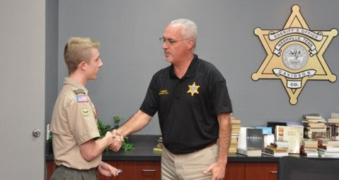 Austin delivered the books in Sheriff Daron Hall in September 2019.