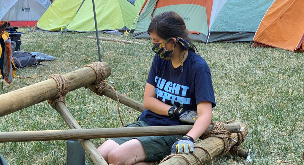Olivia worked on a pioneering project at a Troop 582 SuperCamp in July.