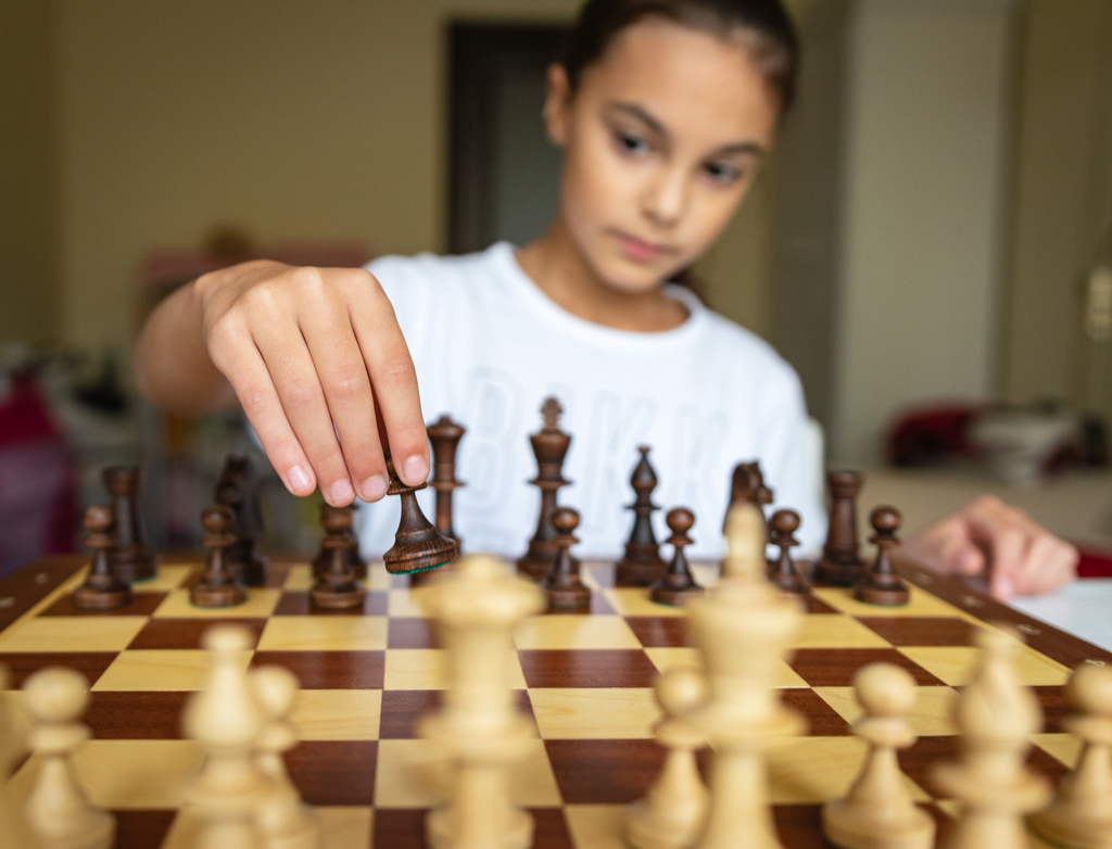 girl playing chess