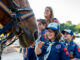 Girl Cub Scout Petting a horse