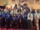 Scouts standing in the church's sanctuary