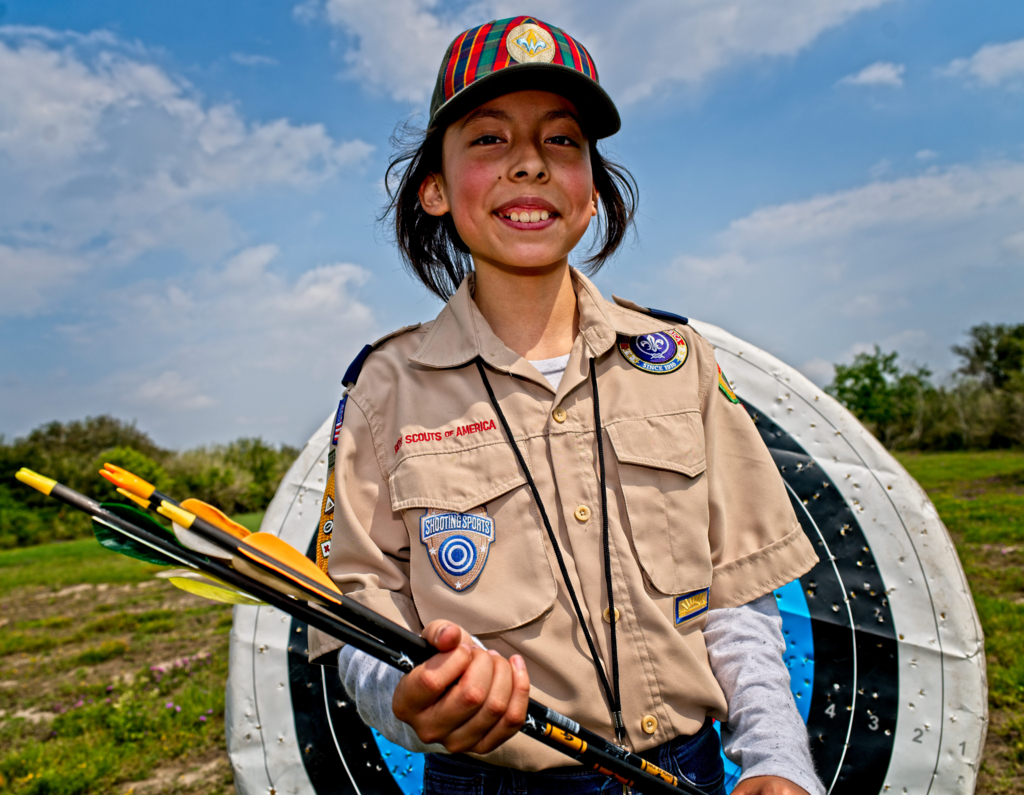 A Scouts BSA member practicing archery