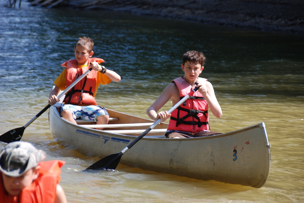Scouts canoeing at summer camp