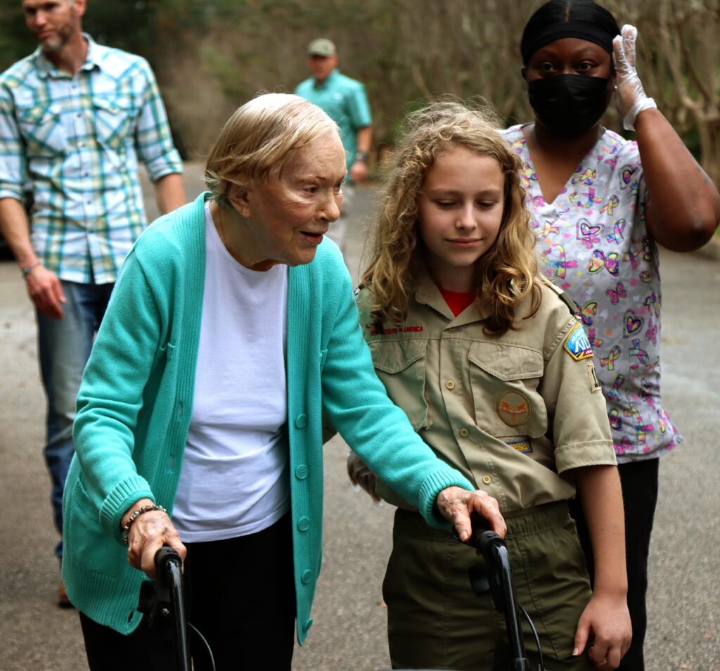 Rosalynn Carter walking with Errol Carter Kelly