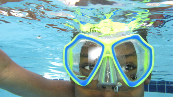 Cub Scout practicing aquatics safety
