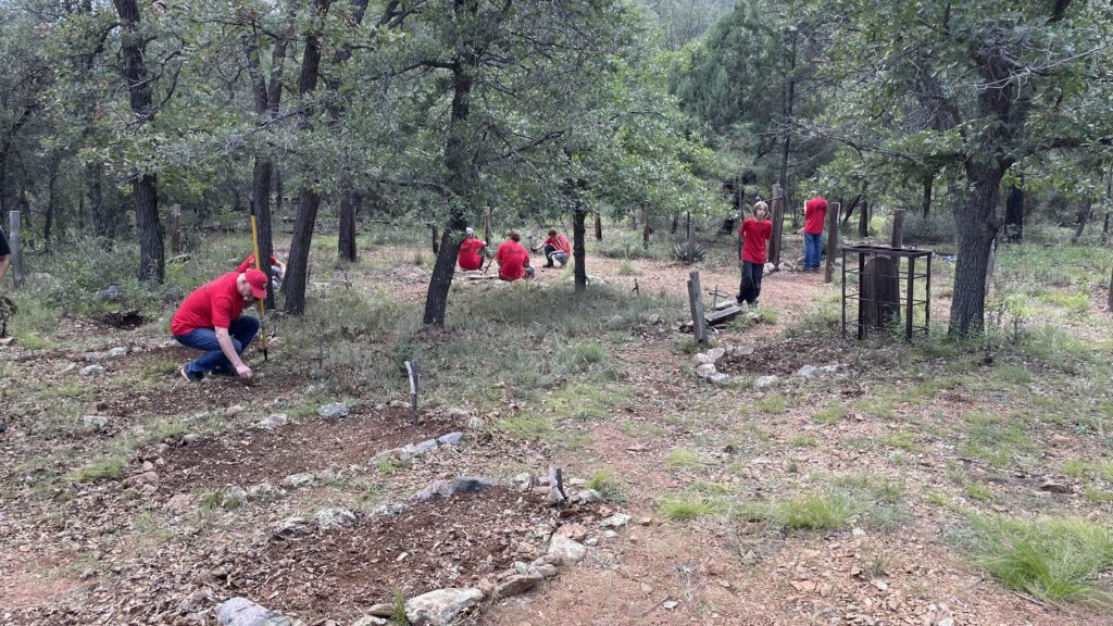 Scouts perform service at a nearby cemetery