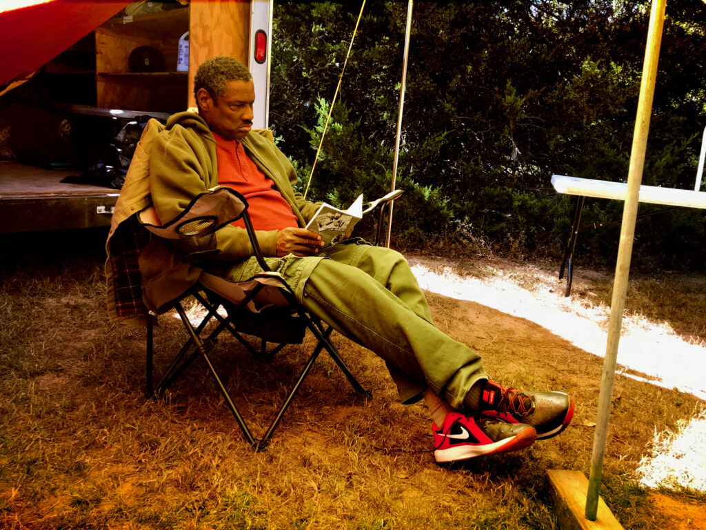 Darrell White reads a merit badge pamphlet