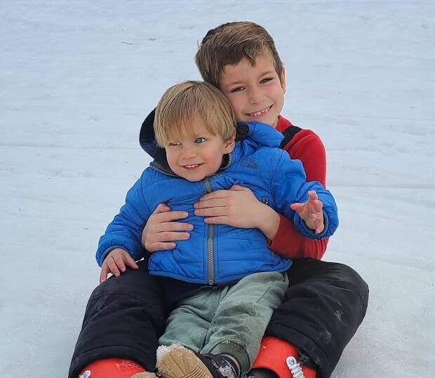 Cameron and little brother Cyrus play in the snow