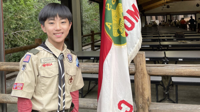 A photo of 12-year-old college graduate Clovis Hung
