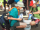 Scouts put supplies into a flood bucket