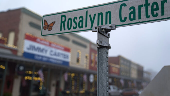 A photo of a street sign that reads "Rosalynn Carter"