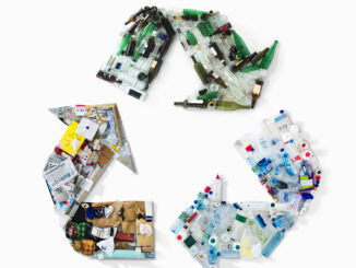An image of recycling materials in shape of recycling symbol