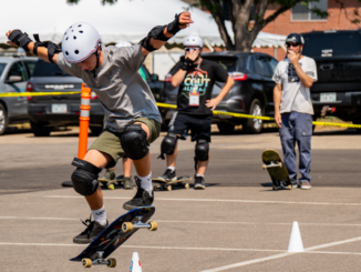 A photo of a Scout skateboarding at the 2024 National Order of the Arrow Conference