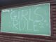 A photo of a chalkboard with the words "Girls Rule"