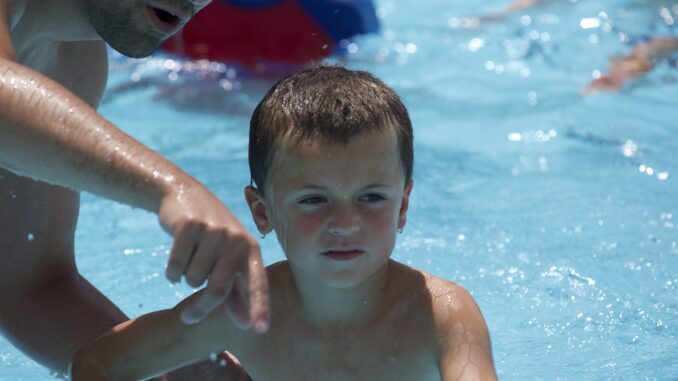 Photo of a Cub Scout swimming