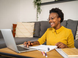 A photo of a Cub Scout mother taking online training
