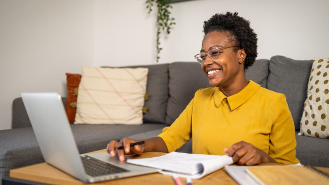 A photo of a Cub Scout mother taking online training