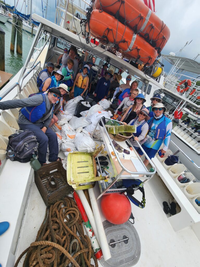 A photo of Scouts picking up trash from the ocean