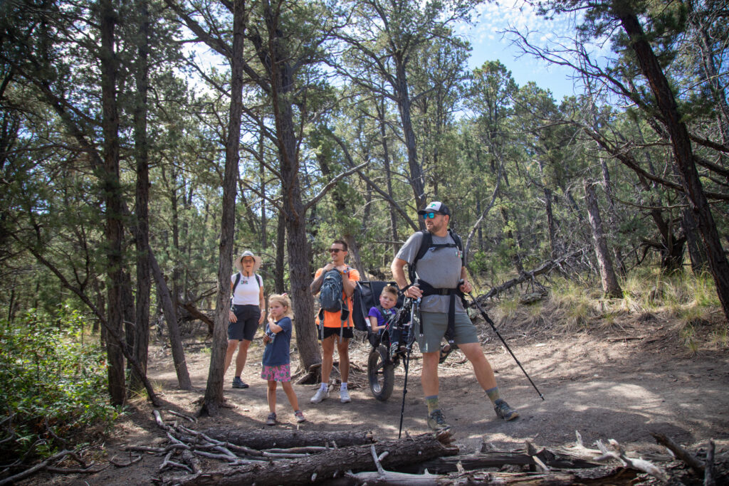 A photo of a family participating in a hike at Philmont Scout Ranch