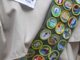 Close-up of sash with merit badges