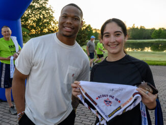 NFL running back David Montgomery at the 2025 National Annual Meeting with Andrea Marron, 2024-2025 National Venturing President