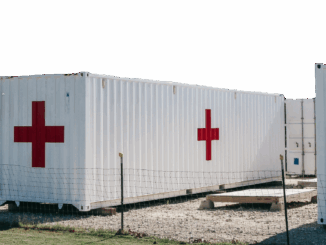 A photo of a shipping container that's been converted to a fully functional medical facility