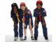 A photo of three Cub Scouts, each of whom are very excited to join Scouting