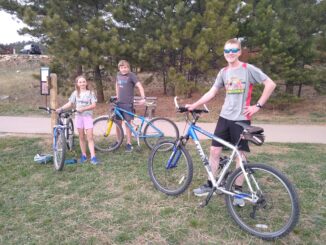 A photo of three Scouts who have earned the Multisport merit badge