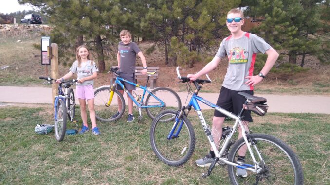 A photo of three Scouts who have earned the Multisport merit badge