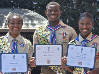 A photo of the Rivers triplets, Eagle Scouts and competitive alpine skiers