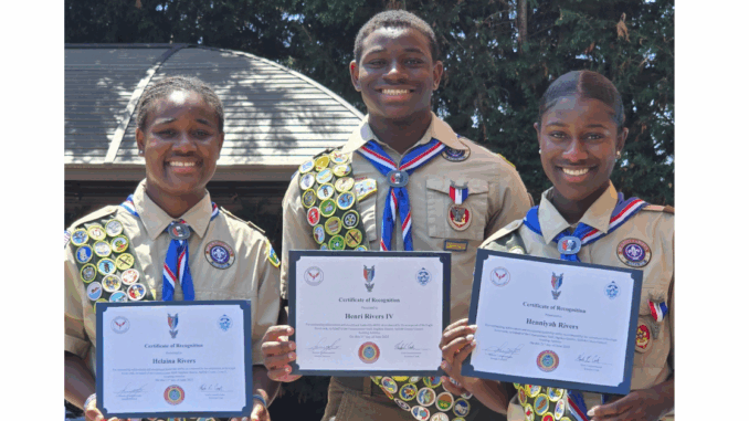 A photo of the Rivers triplets, Eagle Scouts and competitive alpine skiers