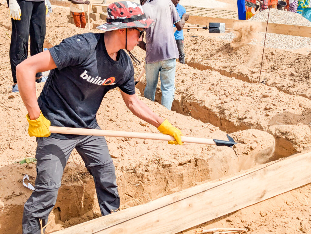 Aeron works on the process of preparing the building's foundation