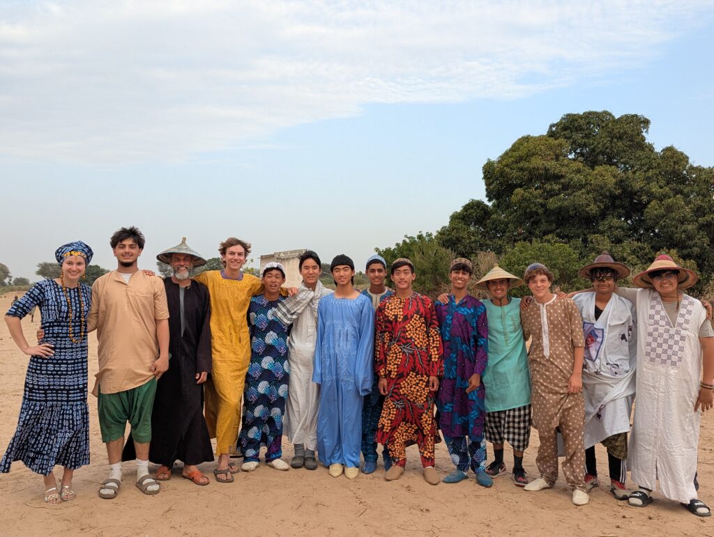 Aeron (sixth from right) and Julian (fourth from right) participate in one of the daily cultural activities.